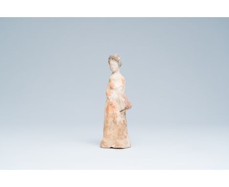 Full title: A Chinese polychrome painted pottery figure of a lady, TangDescription: H 21,8 cm    The dating of this lot is co