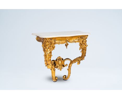 Full title: An Italian gilt wood wall console with white marble top, 19th C.Description: H 83 - L 87 cm