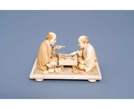 Full title: A Japanese ivory okimono of two go players, Meiji, 19th C.Description: H 10,1 - L 16 - D 10 cmLot subject to CITE