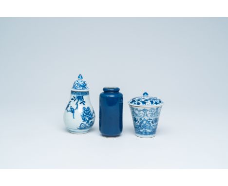 Full title: A Chinese blue and white covered cup, a covered vase and a small monochrome blue rouleau vase, Kangxi and laterDe