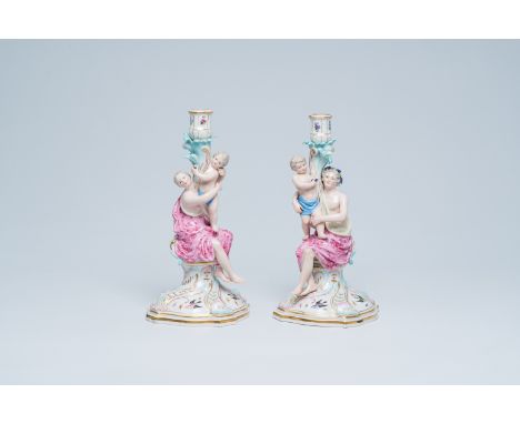 Full title: A pair of German polychrome and gilt Meissen porcelain candlesticks in the shape of a classical nymph with an amo