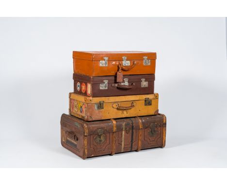 Full title: Three various leather travel cases and a steamer trunk with labels of various travel destinations, ex-collection 