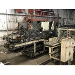 Hartness model 825 drop caser, set up with a 20 ounce 4 x 5 pattern grid, stainless steel table
