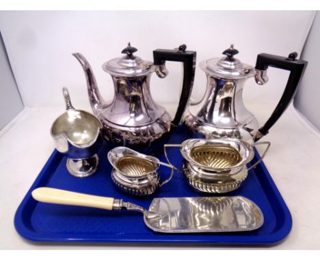 A pair of silver plated teapots together with further silver plated items to include milk jug, sugar basin, sauce boat and sc