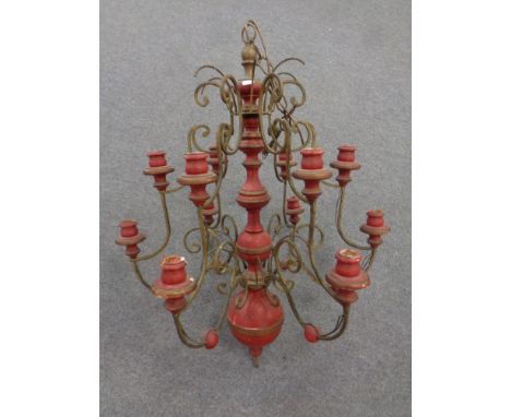 An antique Belgian painted metal and wood six branch, twelve light chandelier 