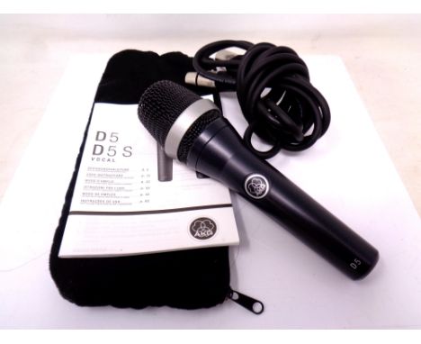 An AKG D5 Microphone in bag together with lead and manual.