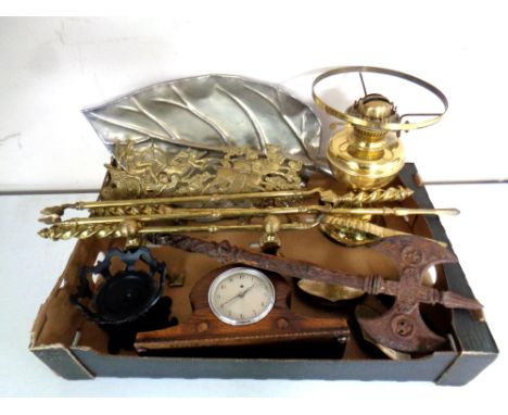 A box of assorted metal ware to include antique companion pieces, brass oil lamp base, cast iron axe, early 20th century comm
