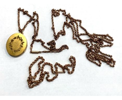 An antique yellow metal muff chain, together with two further chains and a pendant.