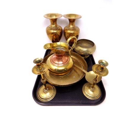 A tray of antique and later brass wares, pair of candlesticks, ladle, eastern vases etc 