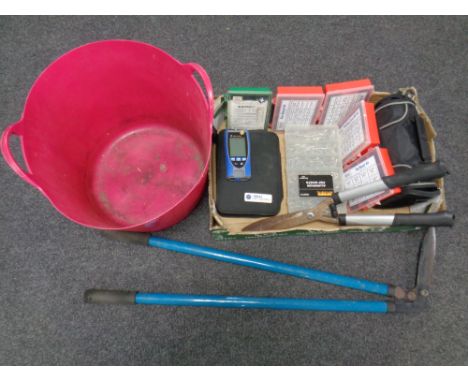 A box containing an ideal networks cable finder, plastic boxes containing washers, rivets, etc, plastic builder's bucket toge