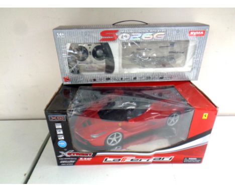 An X Street 1:12 scale Ferrari remote control car together with a Gyro remote control transport plane, both boxed 