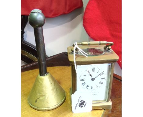 A French Brass Cased Carriage Clock; the white enamel dial with Roman numerals.