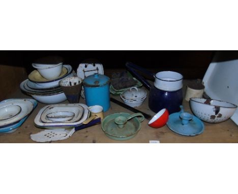 A Crate of Vintage Enamel Wares including colander, chamber sticks, teapots, soap dishes, red ladle, caddy, dishes & bowls.