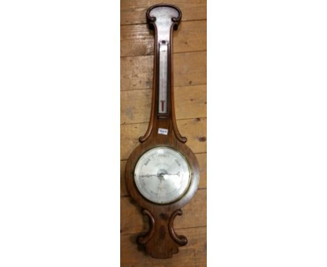 A 19th Century Rosewood Wheel Barometer with an engraved silvered dial and scale.