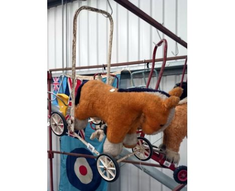 A childrens vintage push along/walker horse