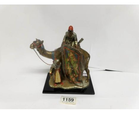 A metal camel with handlers 'lighter'