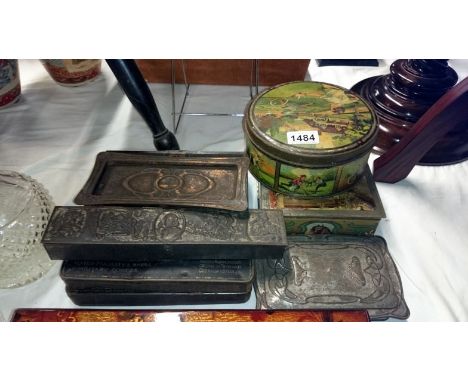 A selection of art nouveau decorated and embossed advertising tins