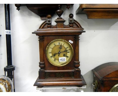A Victorian oak mantel clock