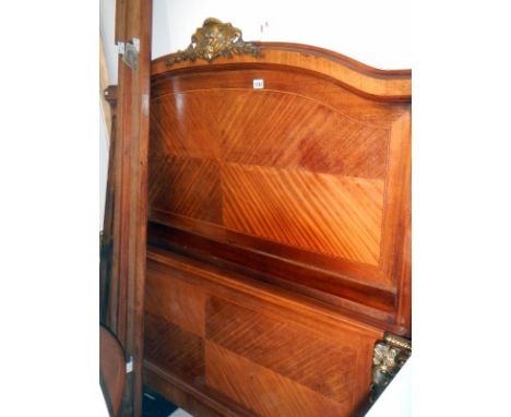 A French wooden double bed with ormalu brass decoration