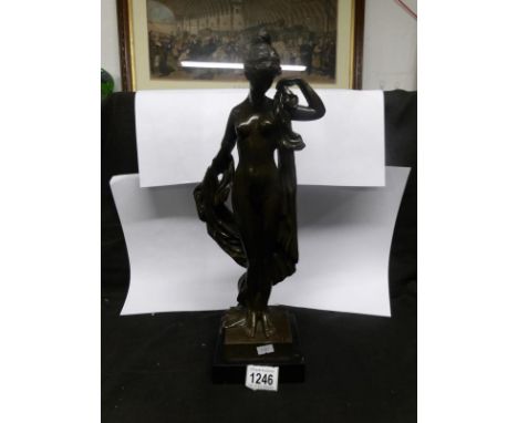 A nude figure of a bronze