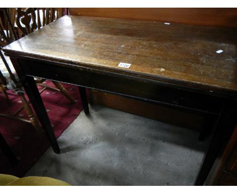 A Victorian oak fold over card table