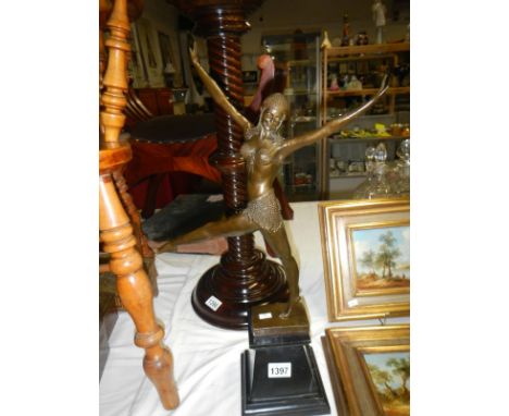 A bronze deco style figure on black marble base