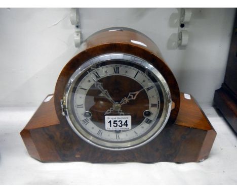 A Westminster chimes mantel clock approx. 8" tall with key and pendulum