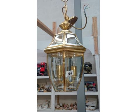 A good quality brass lantern with bevelled glass