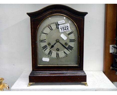 A curved top late Victorian mantel clock 