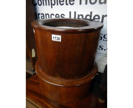 A circular commode a/f (converted to a plant stand)