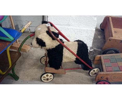 A childrens vintage push along/walker  panda