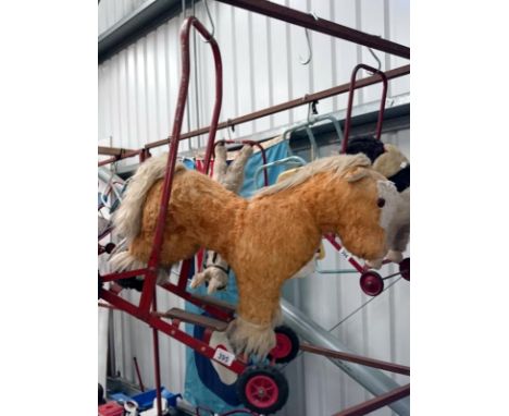 A childrens vintage push along/walker horse
