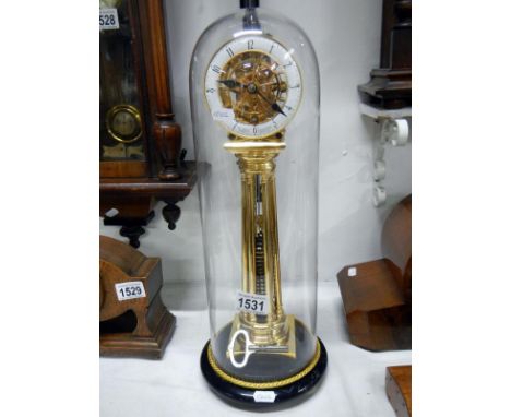 A gilded brass pillar clock by William Smith maker & inventor, Musselburgh, under glass dome