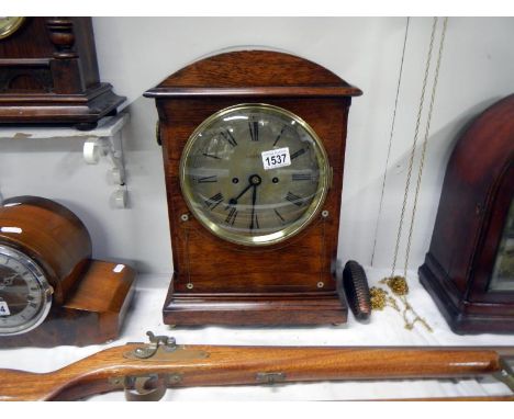 An oak cased fusee bracket clock with mother of pearl inlay and silvered dial by Grant Cardiff