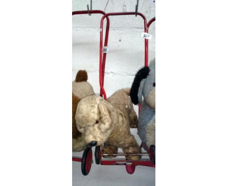 A childrens vintage push along dog