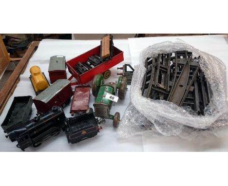 A Hornby meccano train set consisting of locomotive, 6 trucks & quantity of track a clockwork toy of a Fordson tractor & a 2 