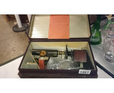 A Casio R & J Beck London microscope