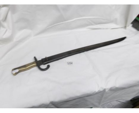 A 19th century French bayonet with scabbard dated on blade 1869