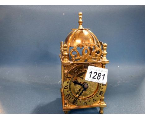 A brass lantern clock