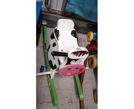 A childs vintage ride on cow