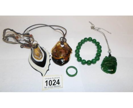 A jade ring, a jade pendant, a jade bracelet and 2 other pendants