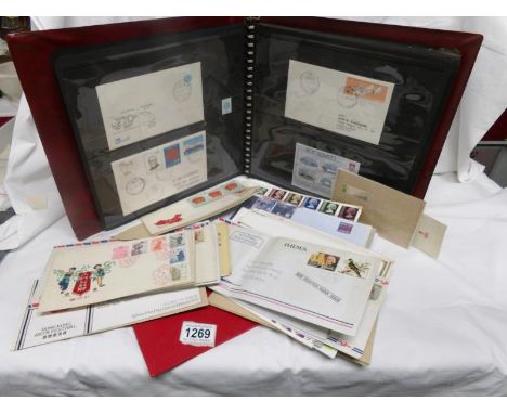 A first day cover album together with a quantity of first day covers and Jersey 1986 mint stamps