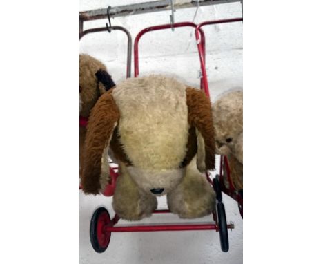 A childrens vintage push along dog
