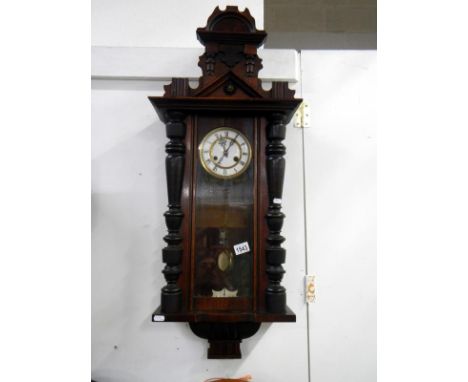 A Springer wall clock with key and pendulum