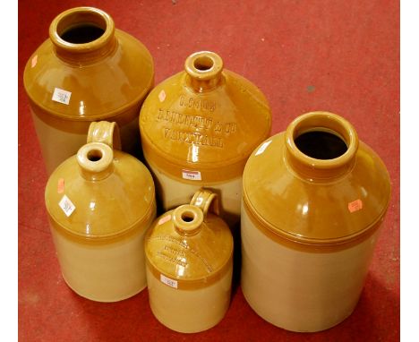 A collection of five stoneware flagons to include Doulton examples, for R Bennet & Co of Vauxhall, The Star Brewery Cambridge