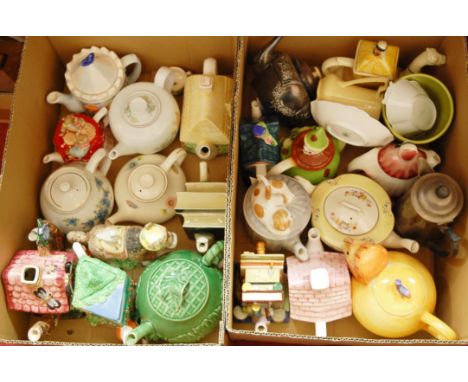 Four boxes of miscellaneous items to include; novelty teapots, various mugs, mahogany tea caddy etc 
