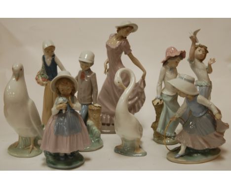 A large Nao figure of a woman; together with various other Nao figures to include; children, swan etc (9)