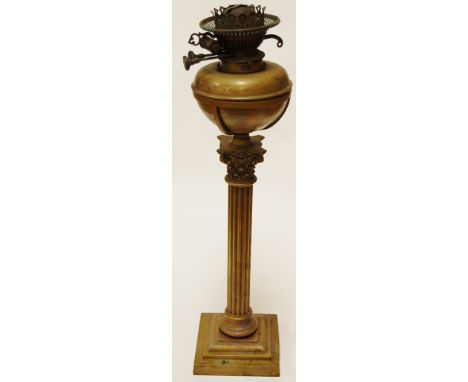 A Victorian brass Messenger patent oil lamp on a brass Corinthian column and stepped base, height 58cm
