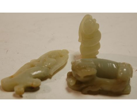 A carved jade pendant in the form of a lady; together with two other jade carvings (3) Condition Report / Extra Information N