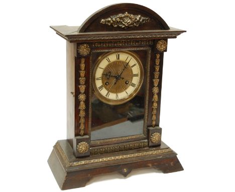 A circa 1900 continental  faux rosewood  cased mantel clock having enamel dial with Arabic numerals and eight day movement